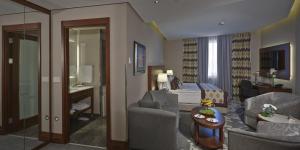 a living room with a couch and a bed at Crowne Plaza Istanbul Oryapark by IHG in Istanbul