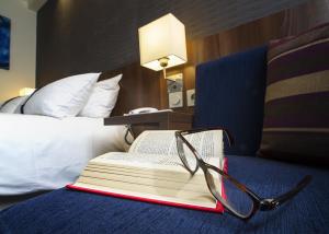 Postel nebo postele na pokoji v ubytování Holiday Inn Express Lille Centre by IHG
