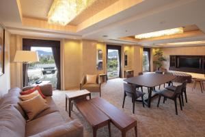 a living room with a couch and a table at ANA Crowne Plaza Hotel Kyoto, an IHG Hotel in Kyoto