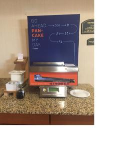 a box on a counter with a sign on it at Holiday Inn Express Hotel & Suites Howell by IHG in Howell
