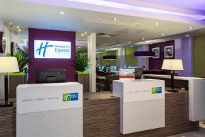 an office with a reception desk and a lobby at Holiday Inn Express Harlow, an IHG Hotel in Harlow