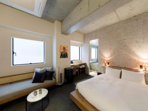 Säng eller sängar i ett rum på Hotel Mei Fukuoka Tenjin