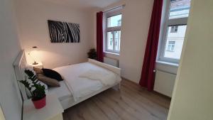 A bed or beds in a room at Le Monde Apartment Bratislava - amazing 5BDR in downtown