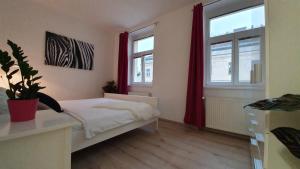 A bed or beds in a room at Le Monde Apartment Bratislava - amazing 5BDR in downtown