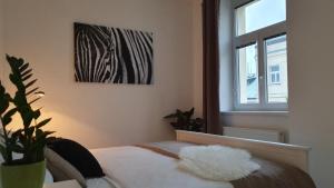 A bed or beds in a room at Le Monde Apartment Bratislava - amazing 5BDR in downtown