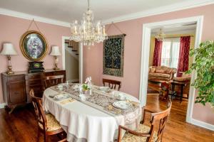 a dining room with a table and a chandelier at Valparaiso Inn B&B in Valparaiso