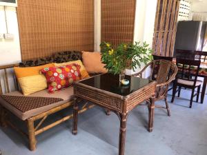a living room with a couch and a table at Lanta Complex in Ko Lanta