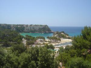 a view of a beach and the ocean at Menorca Bonavista in Cala Galdana
