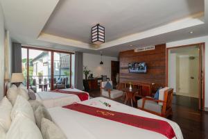 TV a/nebo společenská místnost v ubytování King Rock Boutique Hotel