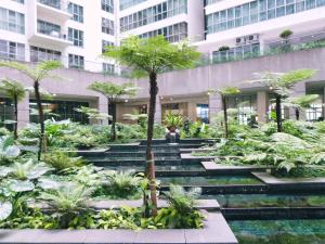 a garden in the middle of a building at Regalia Skypool KLCC in Kuala Lumpur