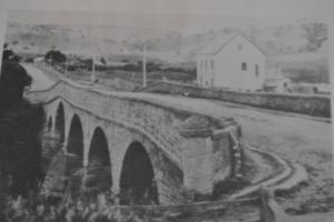 an old photo of a train crossing a bridge at Mulberry Cottage Unique B&B Accommodation in Richmond
