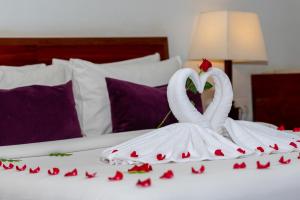 Postel nebo postele na pokoji v ubytování King Rock Boutique Hotel