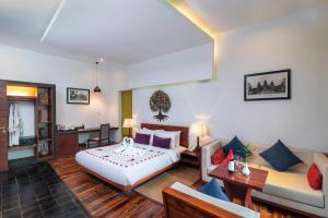 Postel nebo postele na pokoji v ubytování King Rock Boutique Hotel