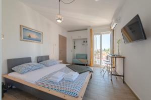 Postel nebo postele na pokoji v ubytování Narancin Apartments