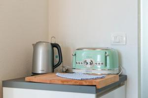 a green toaster sitting on top of a counter at Narancin Apartments in Trogir