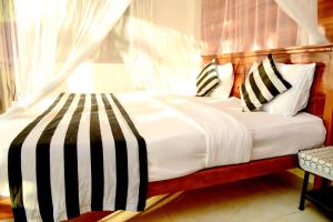 Postel nebo postele na pokoji v ubytování Senasuma Homestay