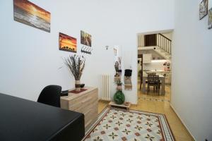 a living room with a couch and a table at Aretè Apartments in Lecce