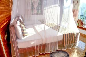 Postel nebo postele na pokoji v ubytování Senasuma Homestay
