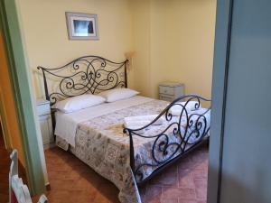 En eller flere senge i et værelse på Agriturismo I CASALI DI MORRO