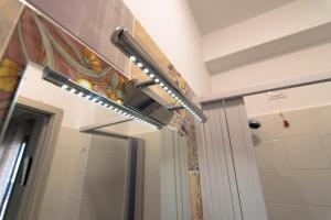 a bathroom with a shower with a mirror at elegance b&b in Cariati +61 photos