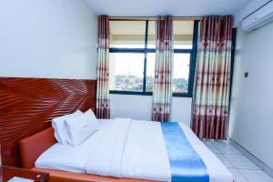 Postel nebo postele na pokoji v ubytování Hotel OK Kampala + 37 fotografií
