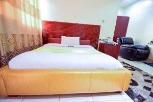 Postel nebo postele na pokoji v ubytování Hotel OK Kampala