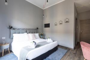 Postel nebo postele na pokoji v ubytování Hotel Miceli - Civico 50