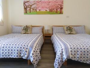 Postel nebo postele na pokoji v ubytování Taroko Xincheng Old Street