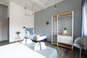 Postel nebo postele na pokoji v ubytování Hotel Miceli - Civico 50
