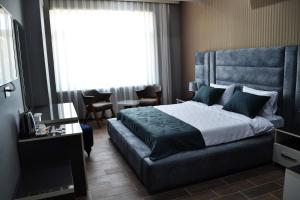Postel nebo postele na pokoji v ubytování Supreme Hotel Baku