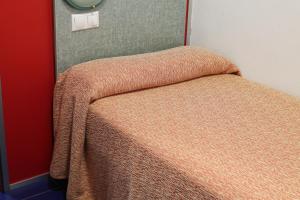 Ein Bett oder Betten in einem Zimmer der Unterkunft Loop INN Hotel Santiago de Compostela