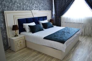 Postel nebo postele na pokoji v ubytování Supreme Hotel Baku