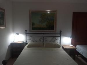 A bed or beds in a room at Residence degli ulivi