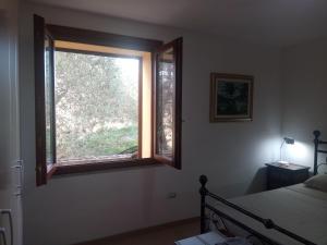 A bed or beds in a room at Residence degli ulivi