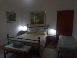 A bed or beds in a room at Residence degli ulivi