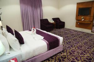 Postelja oz. postelje v sobi nastanitve Amjad Al Deafah Hotel