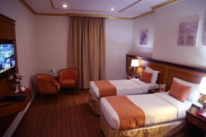 Letto o letti in una camera di Amjad Al Deafah Hotel