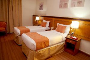Letto o letti in una camera di Amjad Al Deafah Hotel