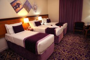 Letto o letti in una camera di Amjad Al Deafah Hotel