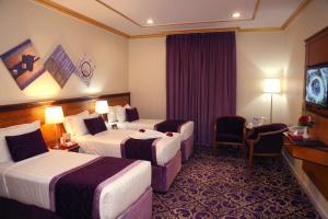 Letto o letti in una camera di Amjad Al Deafah Hotel