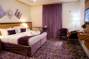 Letto o letti in una camera di Amjad Al Deafah Hotel