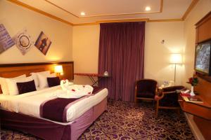 Letto o letti in una camera di Amjad Al Deafah Hotel