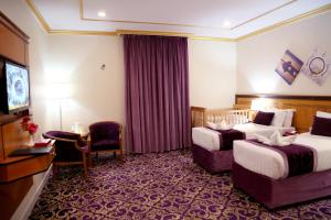 Letto o letti in una camera di Amjad Al Deafah Hotel