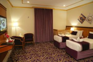 Letto o letti in una camera di Amjad Al Deafah Hotel