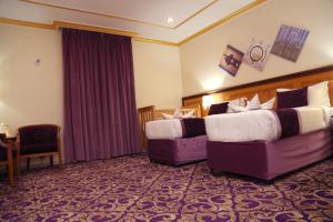 Letto o letti in una camera di Amjad Al Deafah Hotel