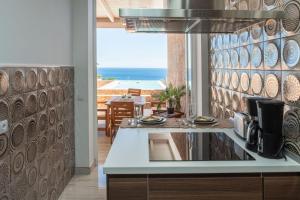 a kitchen with a view of the ocean at Villa del Mar Esquinzo Jandia Fuerteventura in Playa Jandia