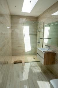 a bathroom with a sink and a shower at Villa del Mar Esquinzo Jandia Fuerteventura in Playa Jandia