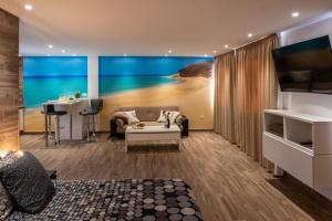 a living room with a view of a beach at Loft del Mar 1 Jandia in Playa Jandia