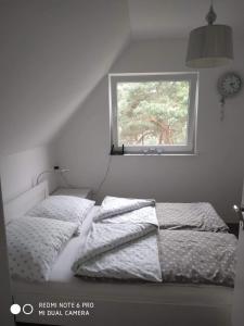 Tempat tidur dalam kamar di Michałek