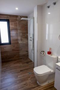 a bathroom with a toilet and a glass shower at Loft del Mar 2 Jandia in Playa Jandia
